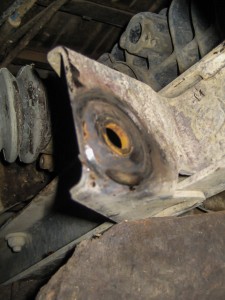 The worn lower control arm mount.