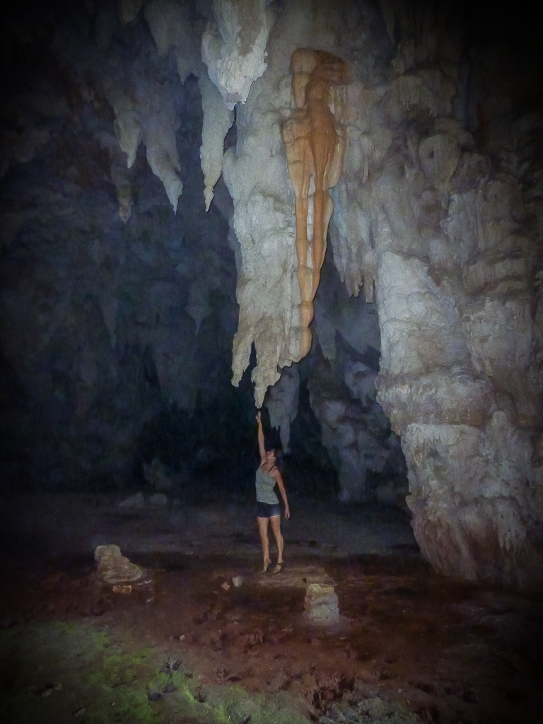 Emily connecting the stalactite to the ground.